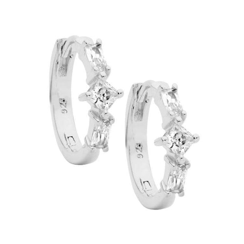 Pair of silver hoop earrings with clear gemstones on a white background